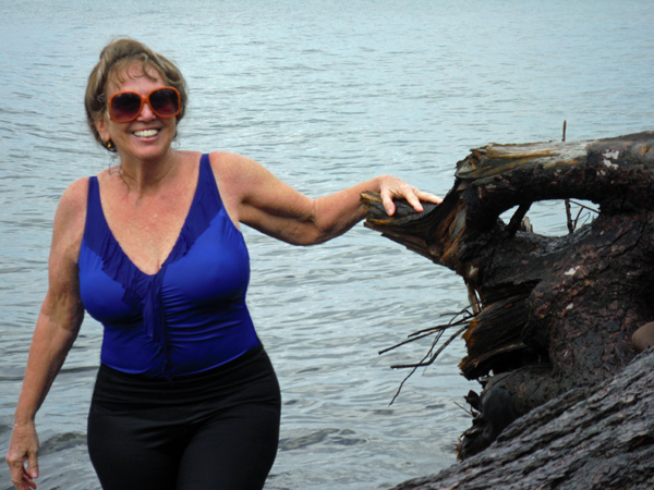 Karen Duquette and a tree stump in Lake Superio